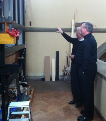 Keith showing Bishop William some of the swell pipework